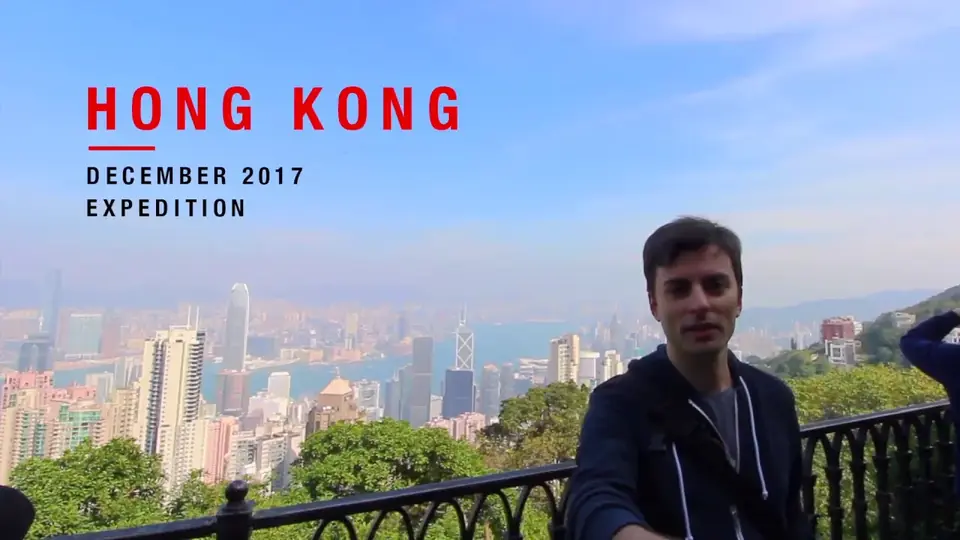 Flavio filming at Victoria Peak with the Hong Kong skyline behind